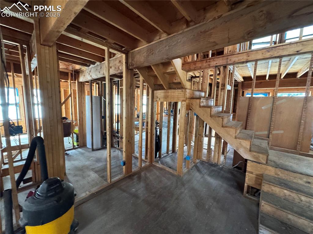 Image 11 of 19: Misc room with healthy amount of natural light and water heater