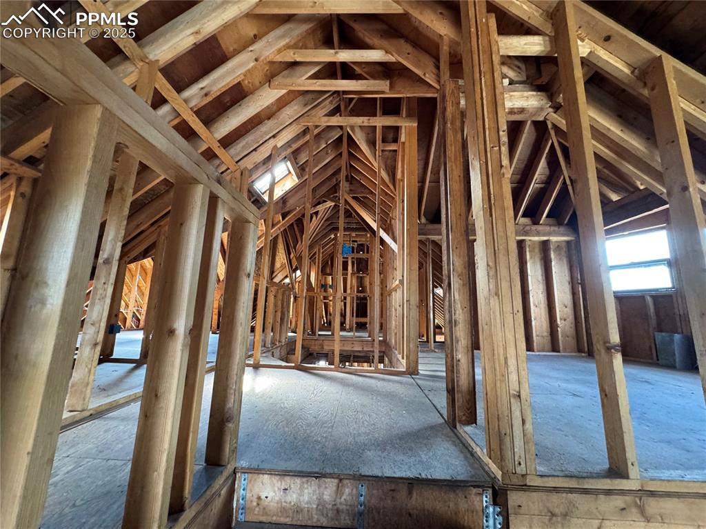 Image 7 of 19: Misc room with lofted ceiling