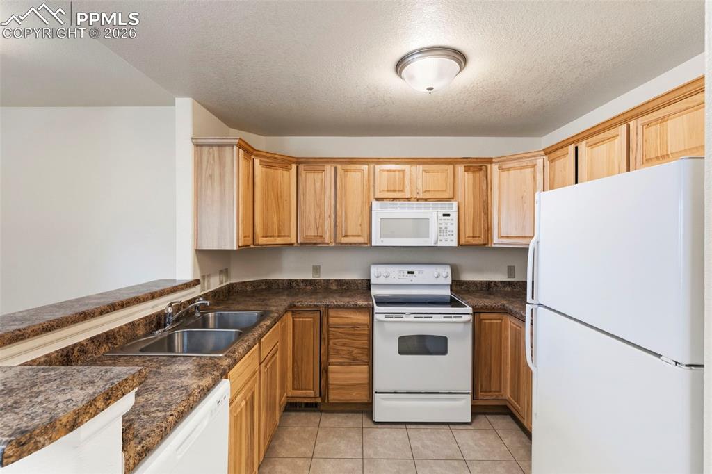 Image 3 of 26: Upgraded Kitchen Cabinets with Crown Moulding