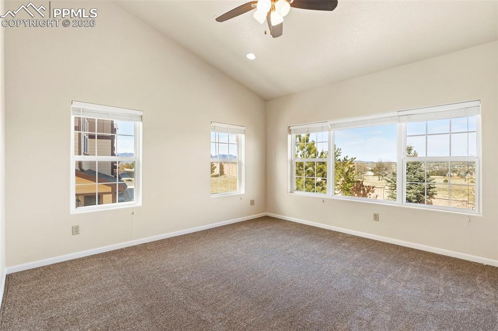 Image 5 of 26: Vaulted Ceilings and Ceiling Fan with Walkout to Private Balcony