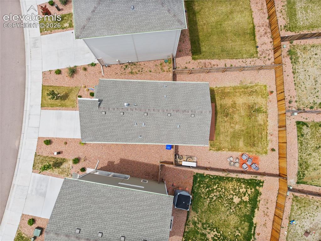 Image 36 of 40: Aerial perspective showcasing a property with a gray shingle roof, a concre
