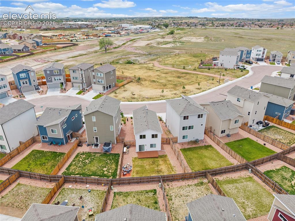 Image 39 of 40: New construction homes with fenced backyards situated on a cul-de-sac