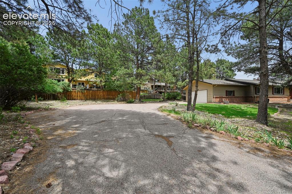 Image 4 of 33: Private lot with plenty of space for playing and parking