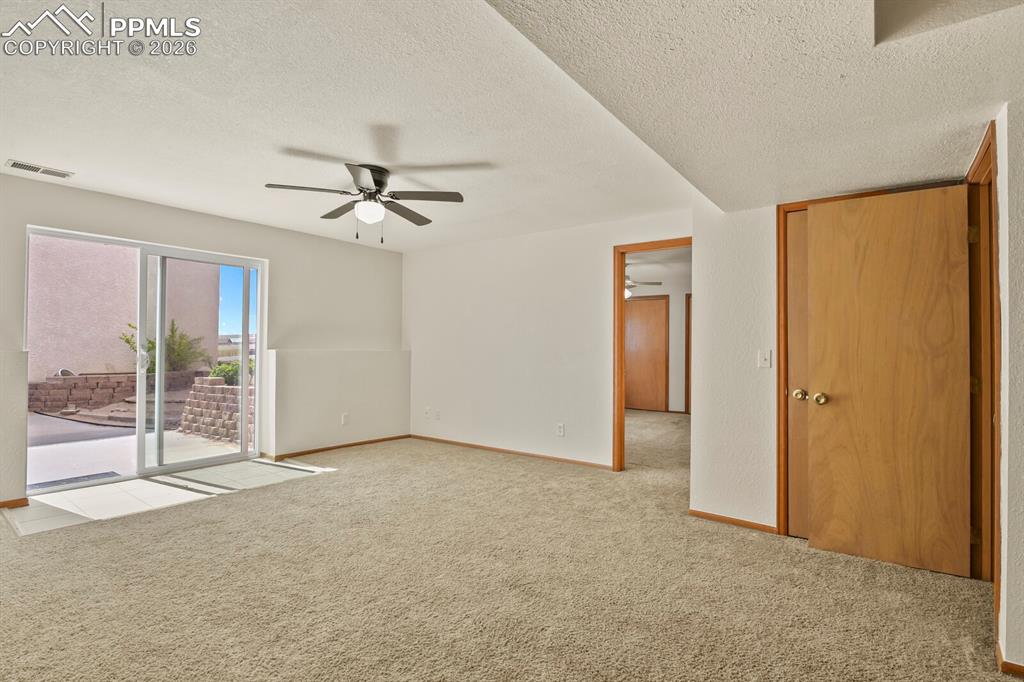 Image 25 of 37: Family room featuring ceiling fan and Walk Out to Rear Yeard and Rear Detac