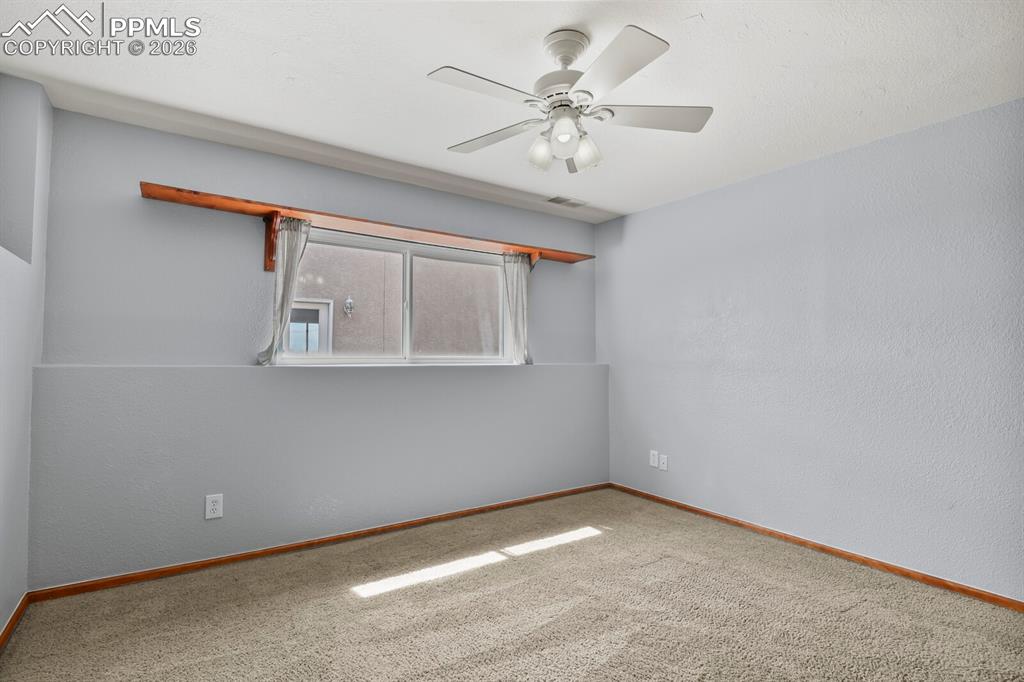 Image 27 of 37: Bedroom with and carpet