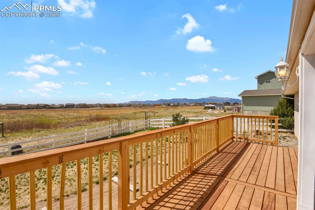 Image 31 of 37: Wooden deck featuring a mountain view and a view of rural / pastoral area