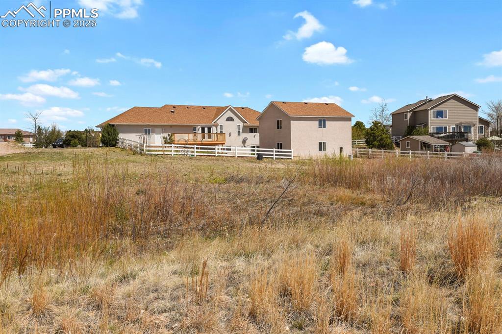 Image 36 of 37: Rear view of house with Deep Lot and Lots of room for RV Parking or Other