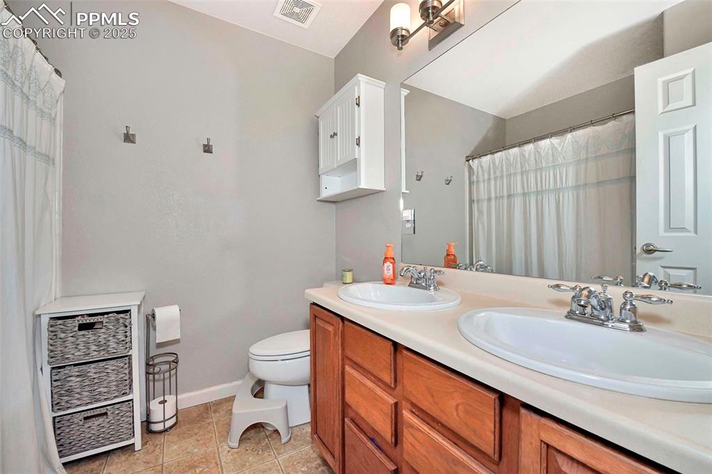 Image 18 of 28: Master Bath with double vanity