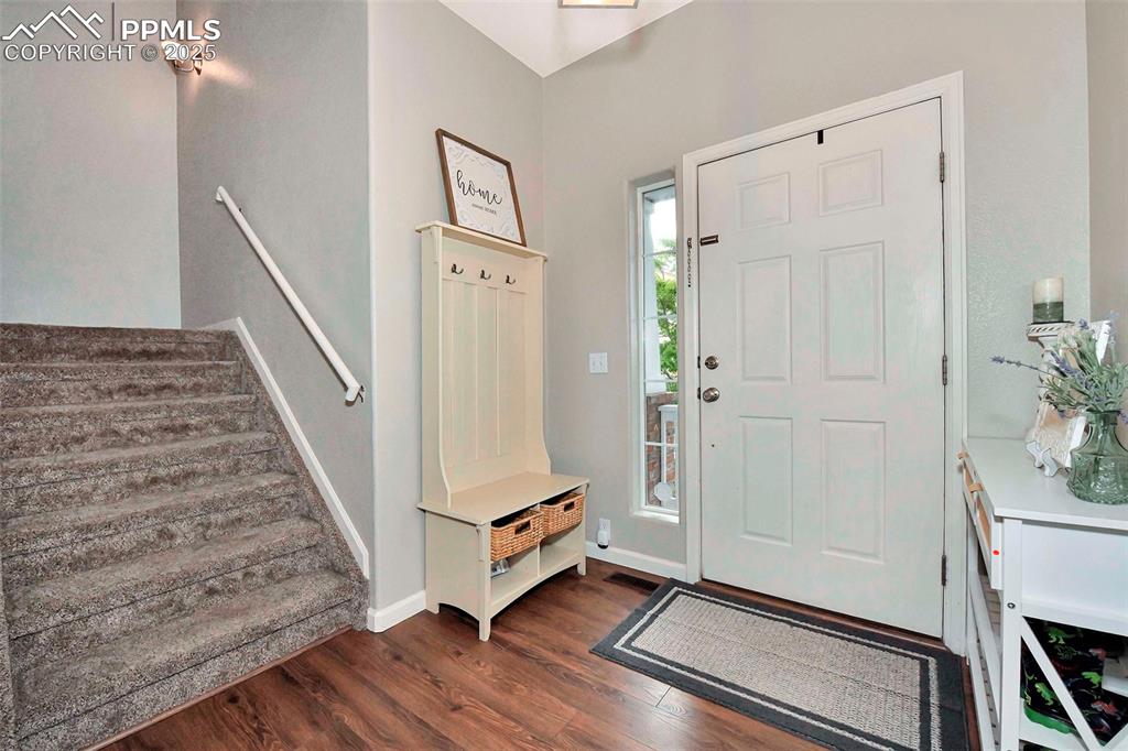 Image 2 of 28: Vaulted roomy entry