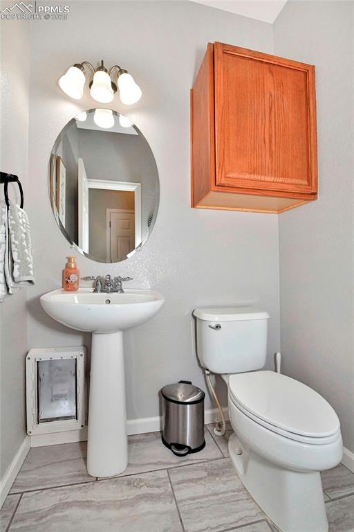 Image 22 of 28: Lower level powder room