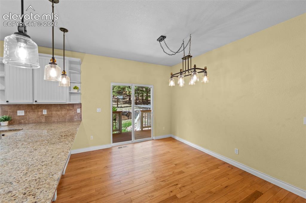 Image 13 of 50: Sunlit Dining Space