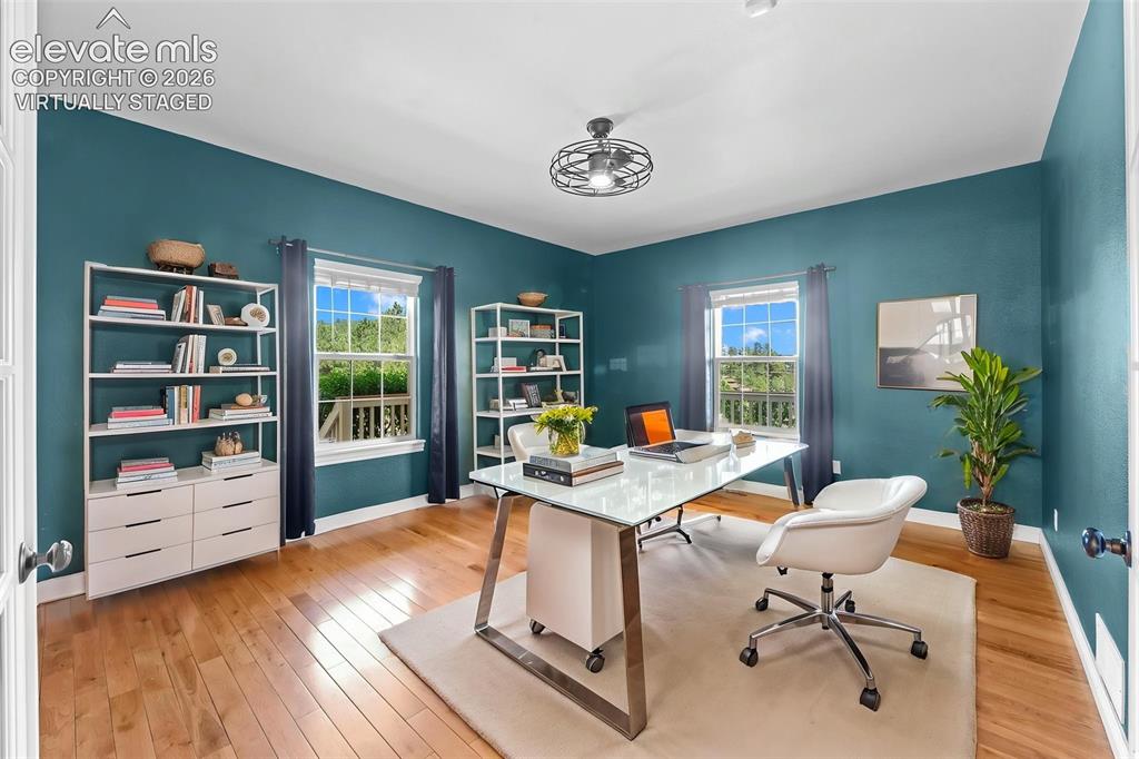 Image 17 of 50: Virtually Staged Executive Office