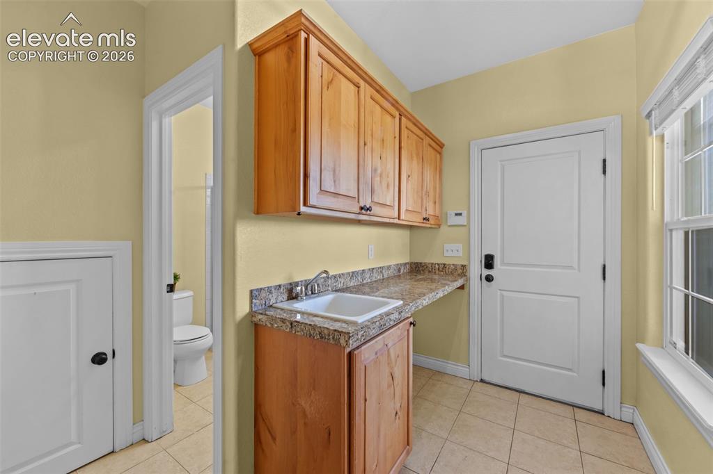 Image 18 of 50: Guest Bath with Vanity Storage