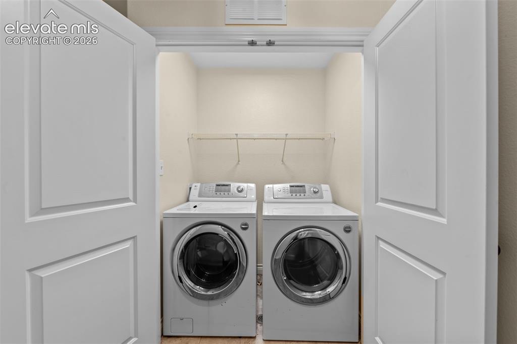 Image 24 of 50: Convenient Laundry Room