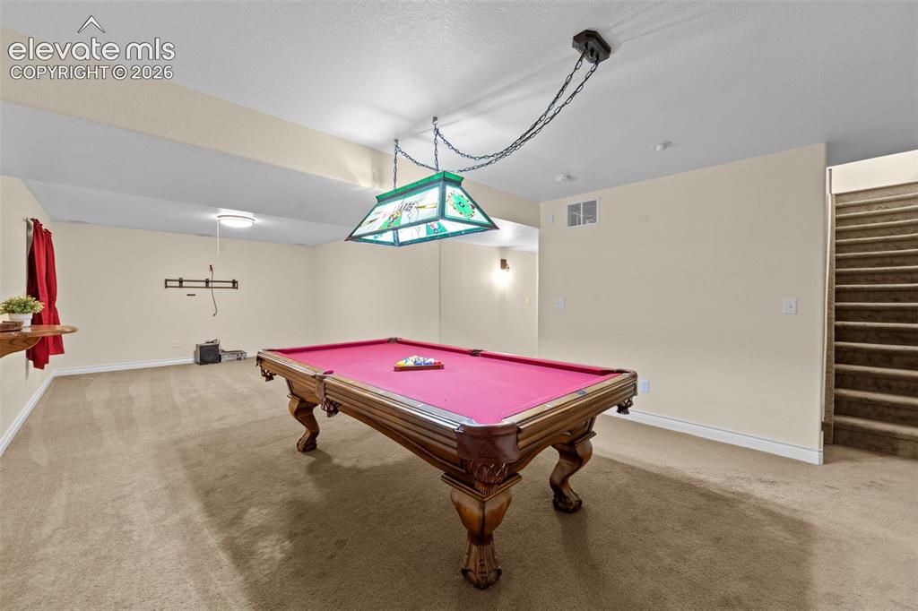 Image 33 of 50: Game Room with Pool Table