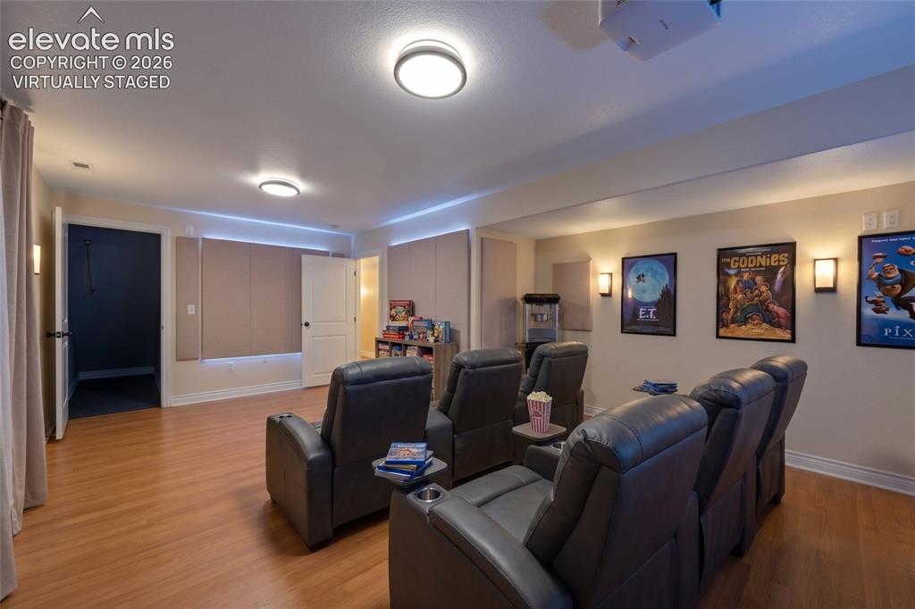 Image 38 of 50: Virtually Staged Media Lounge

Twilight Estate Aerial
Grand Front Elevat
