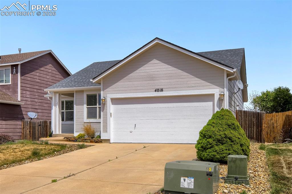 Image 1 of 32: Light-colored siding exterior with a dark-shingle roof, featuring an attach