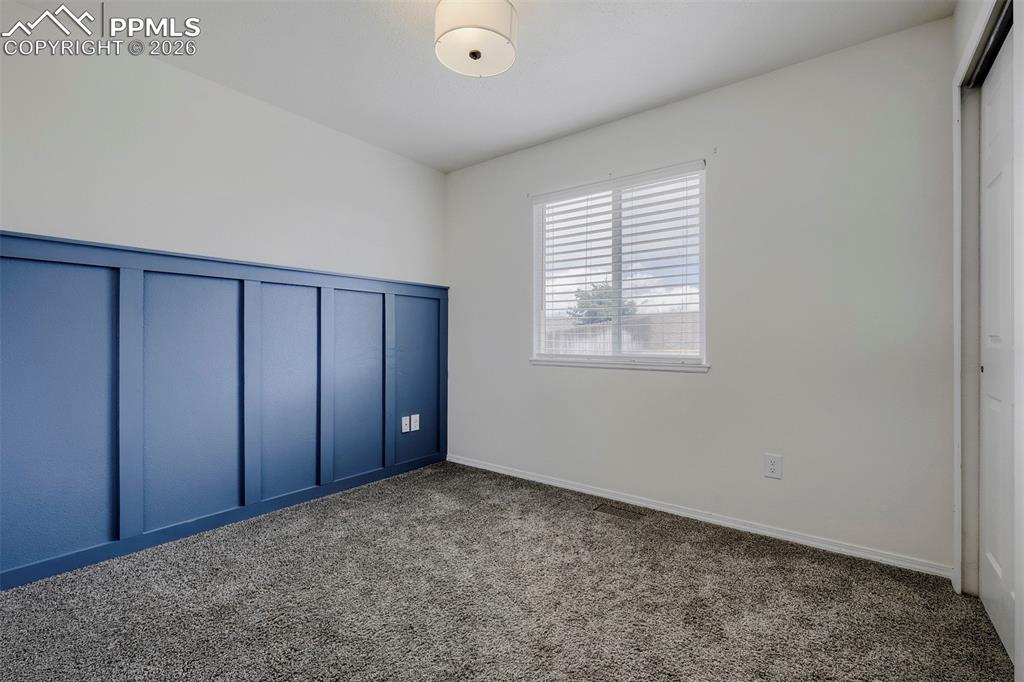 Image 21 of 32: Wall paneling with a blue finish