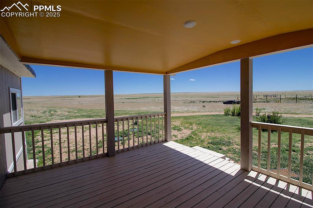 Image 17 of 38: 3425 Wiesner - Wooden terrace featuring a rural view