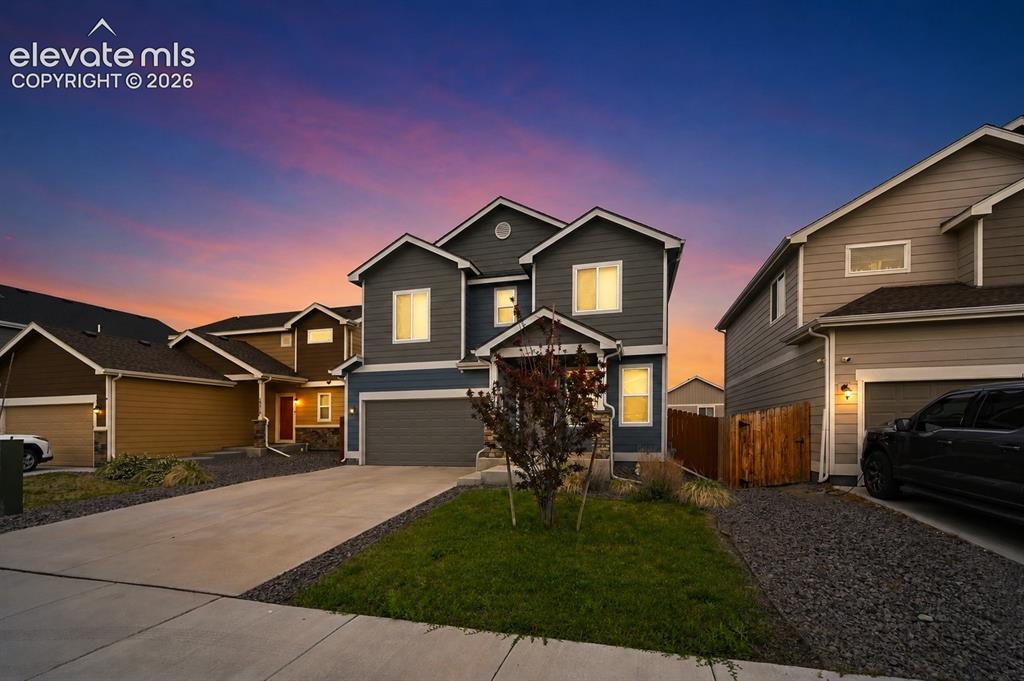 Image 1 of 28: Contemporary siding exterior with a multi-gabled roofline, concrete drivewa