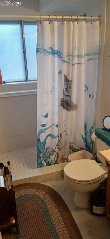 Image 20 of 33: Full bathroom featuring a stall shower, vanity, and tile patterned floors