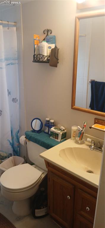 Image 21 of 33: Bathroom featuring vanity and a shower