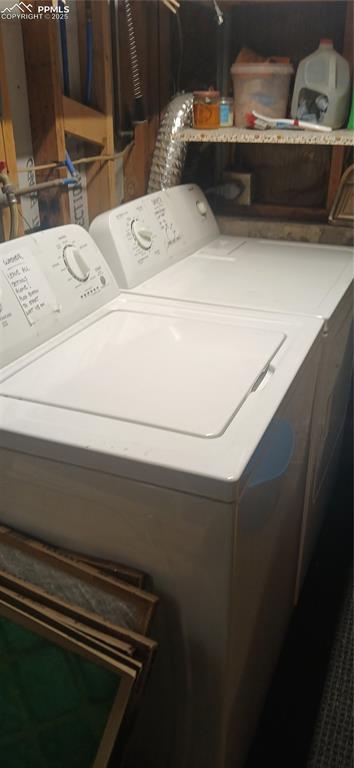 Image 26 of 33: Washroom with washing machine and clothes dryer