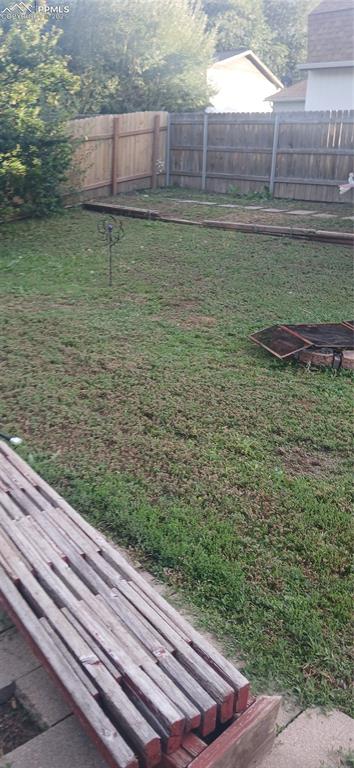 Image 29 of 33: View of fenced backyard