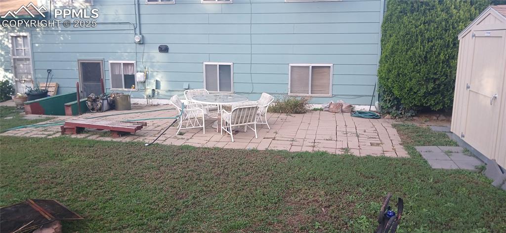 Image 33 of 33: View of patio featuring a storage unit