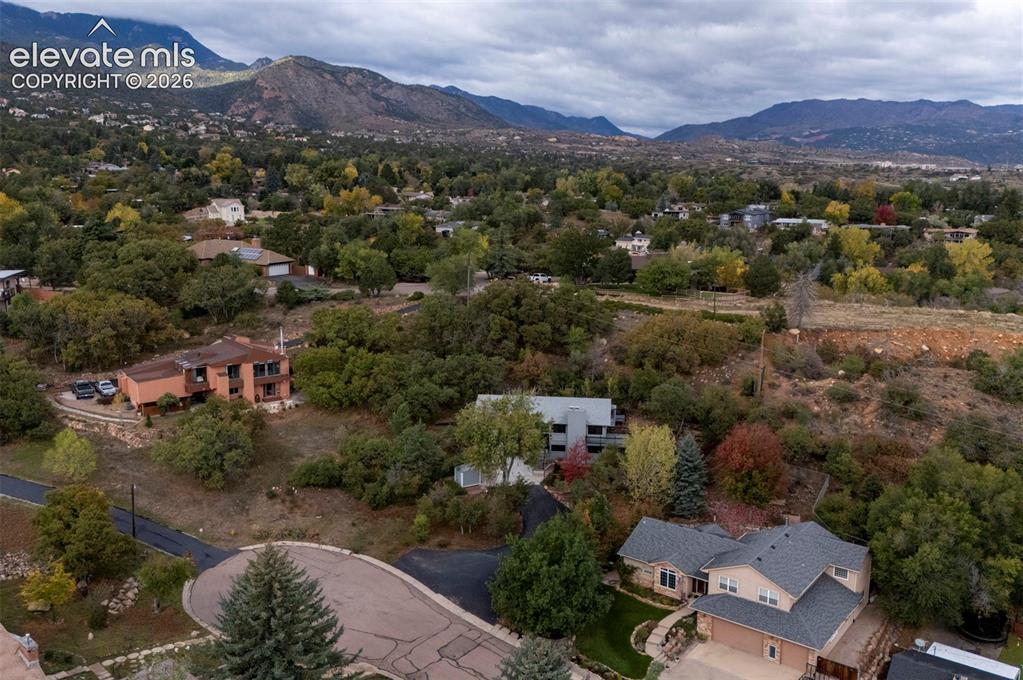 Image 50 of 50: Aerial perspective featuring multi-story residential structures, mature dec