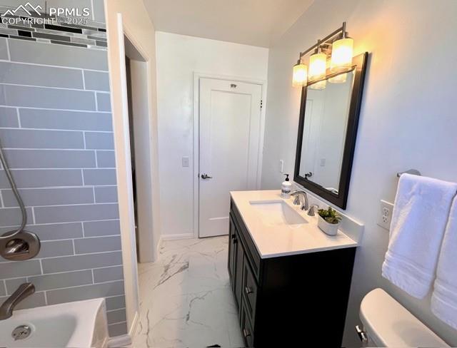 Image 15 of 25: Full bathroom with light marble finish flooring, shower / washtub combinati