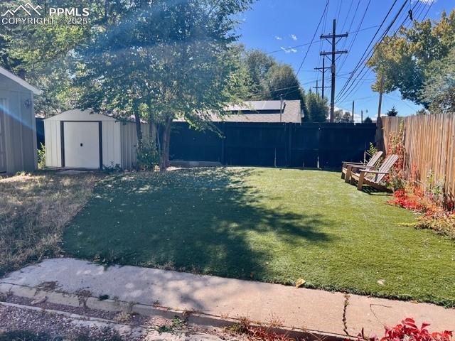 Image 19 of 25: View of yard featuring a shed