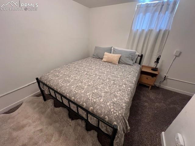 Image 21 of 25: Bedroom with carpet and baseboards