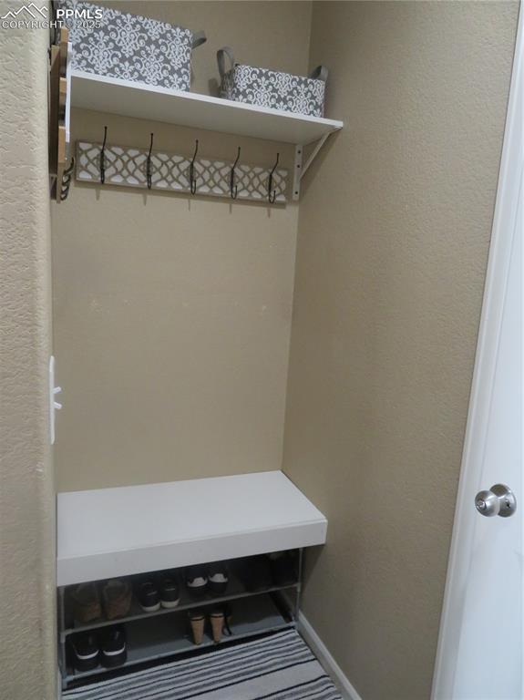 Image 28 of 50: Customized Bench with coat rack and shelf for storage.