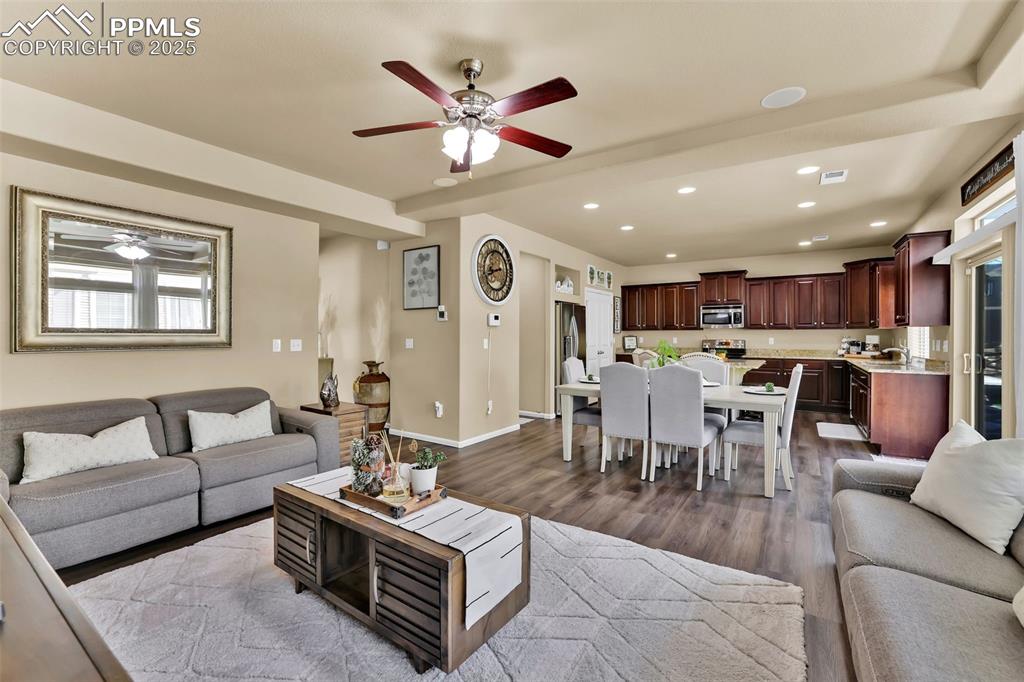 Image 9 of 50: Living area with a ceiling fan, and recessed lighting