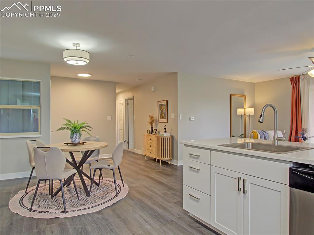 Image 11 of 26: Dining area featuring light wood-style flooring and ceiling fan