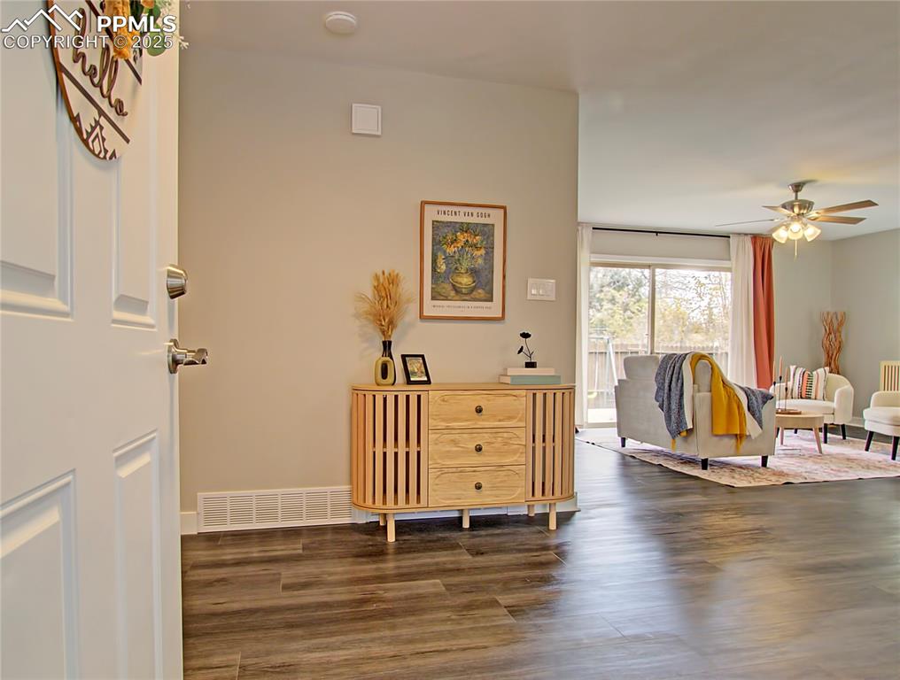 Image 4 of 26: Entrance foyer with wood finished floors and a ceiling fan