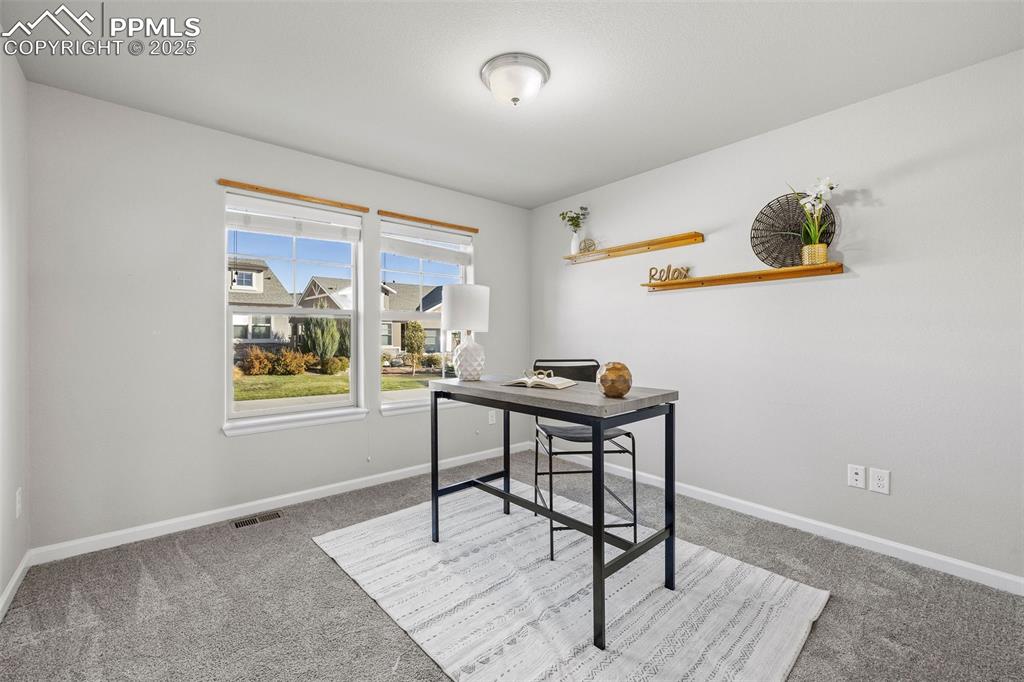 Image 20 of 42: Office space with light carpet