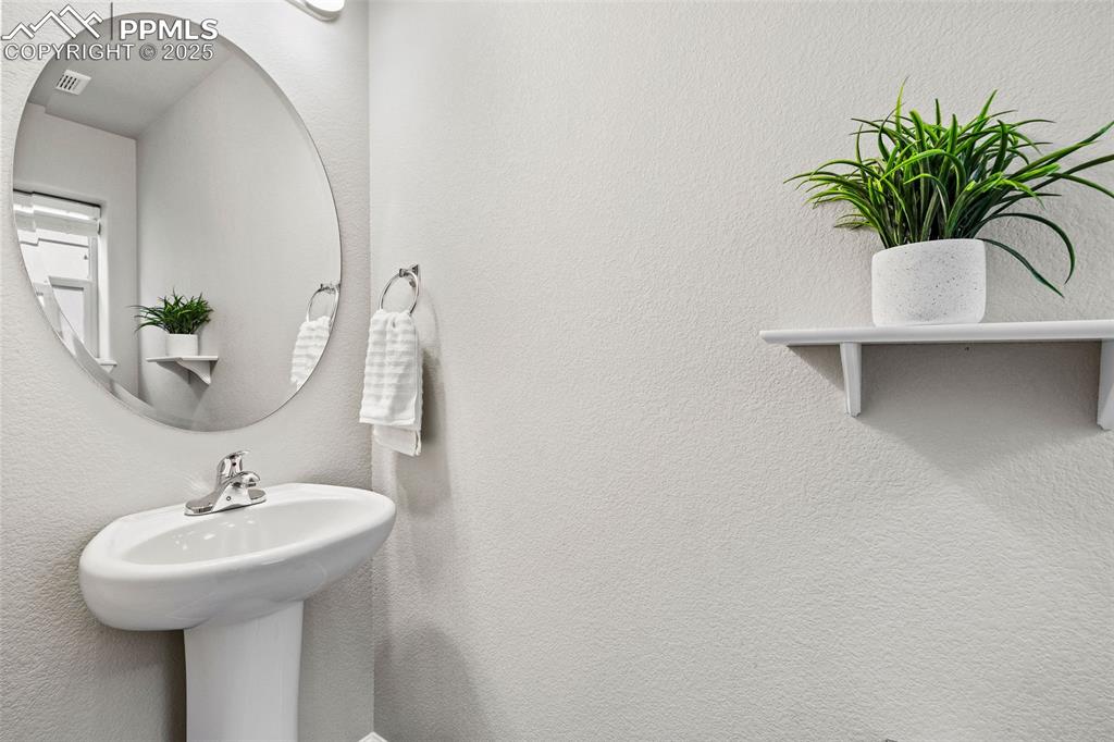 Image 21 of 42: Bathroom featuring a textured wall