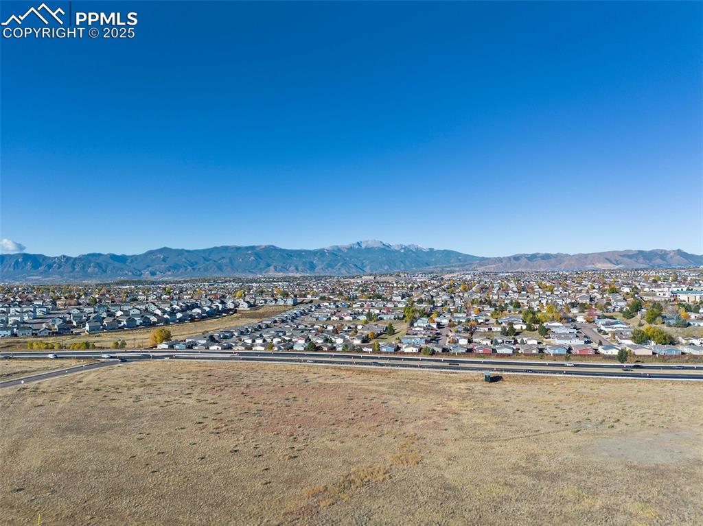 Image 35 of 42: Mountain view with nearby suburban area