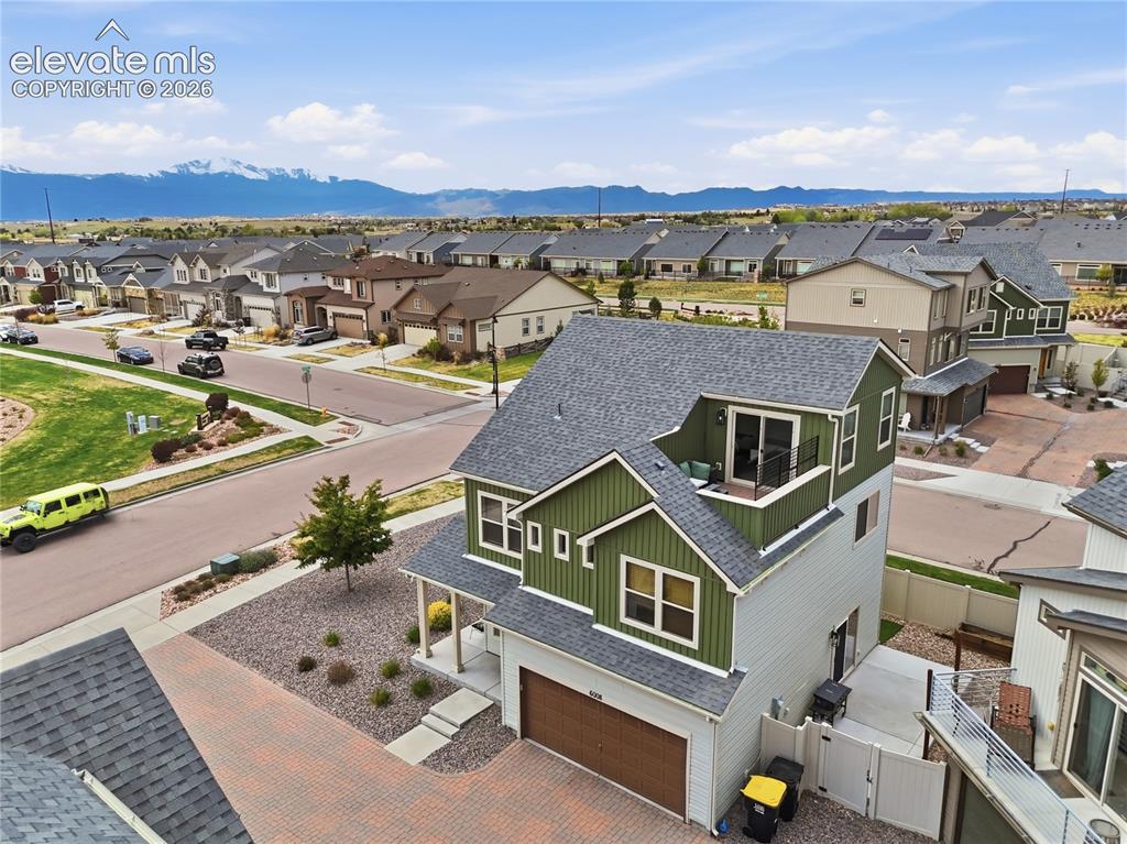 Image 46 of 48: Multi-story residence featuring a two-tone facade, composition shingle roof
