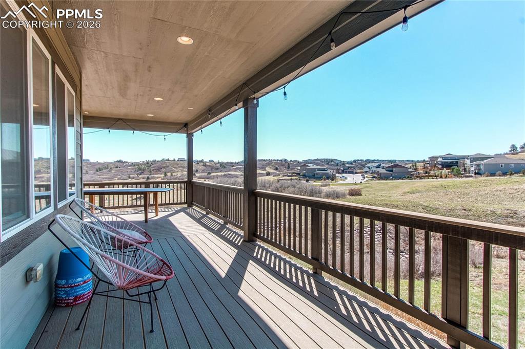 Image 17 of 49: Wooden deck with a residential view