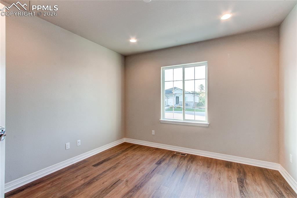 Image 37 of 49: Spare room featuring light wood-style flooring and recessed lighting