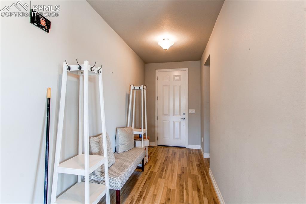 Image 39 of 49: Mudroom with baseboards and light wood finished floors