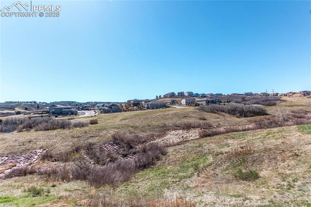 Image 9 of 49: View of local wilderness with nearby suburban area