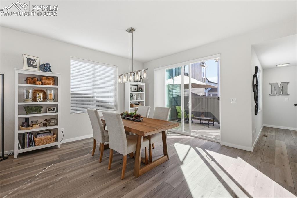 Image 10 of 32: Large dining room with slider that walks out to back patio