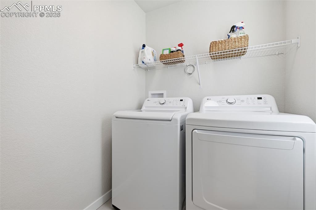 Image 20 of 32: Spacious laundy room with window!