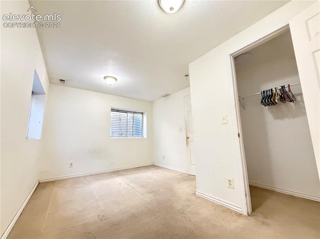 Image 10 of 16: Basement Bedroom