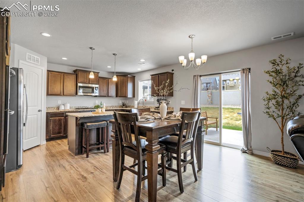 Image 11 of 45: Close enough to the kitchen to stay connected… far enough to avoid doing th