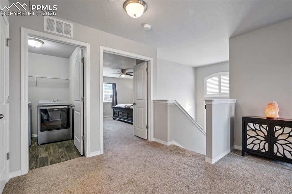 Image 22 of 45: Looking to the Primary bedroom & large laundry room. 